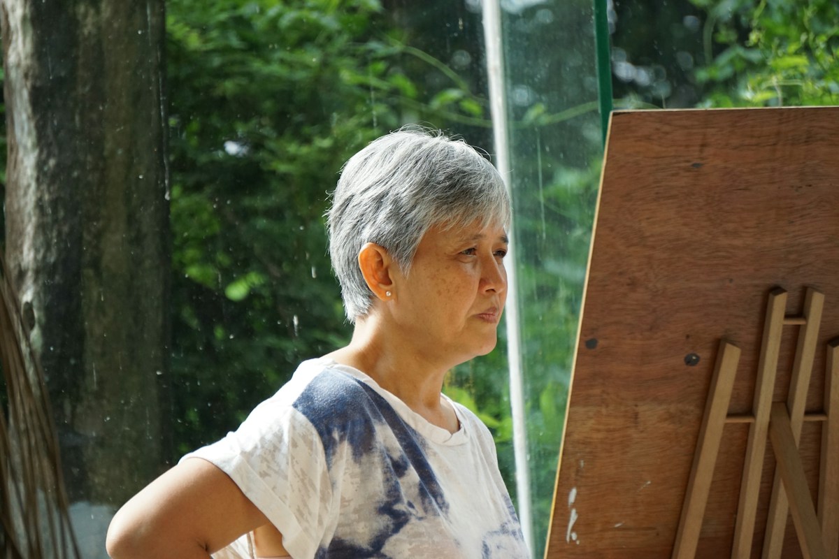 Woman in white and blue crew neck t-shirt in the Philippines